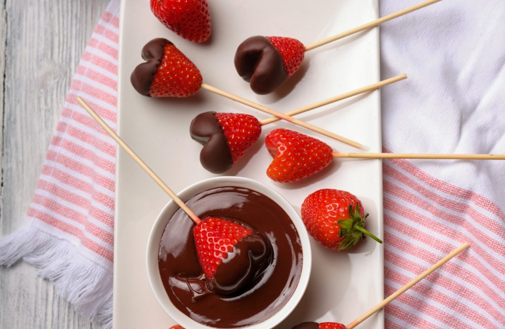 Heart shaped Carob dipped strawberries on stick