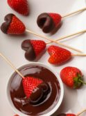 Heart shaped Carob dipped strawberries on stick