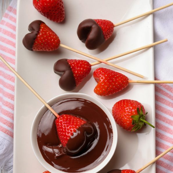 Heart shaped Carob dipped strawberries on stick